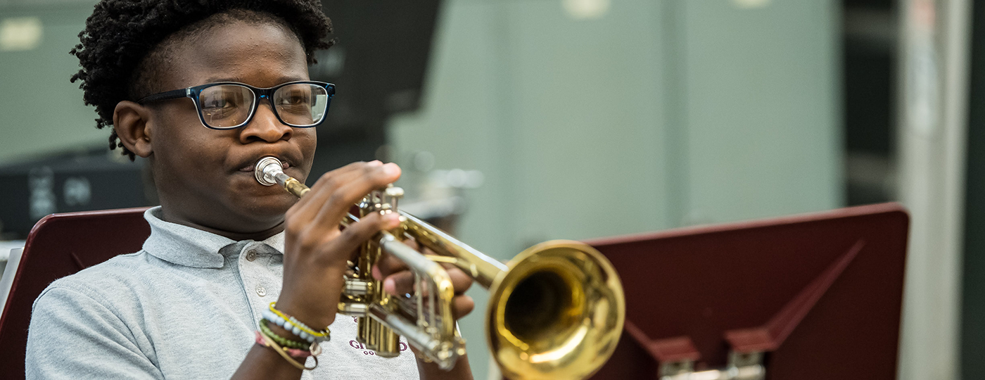 student playing a trumpet