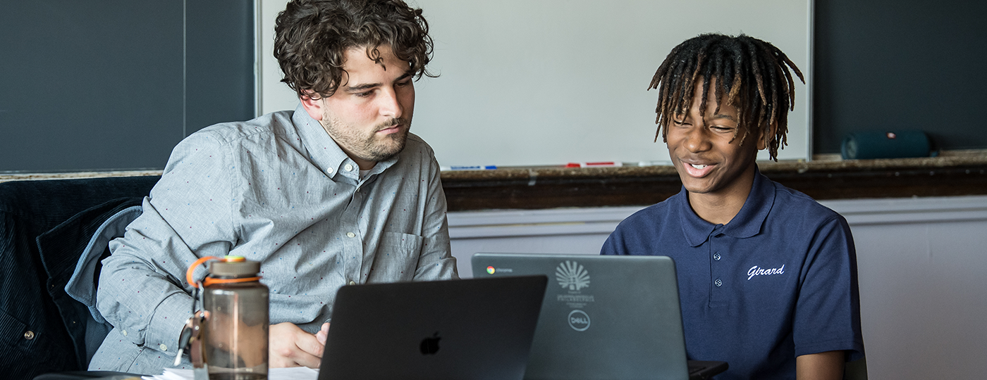 student and a teacher in a classroom