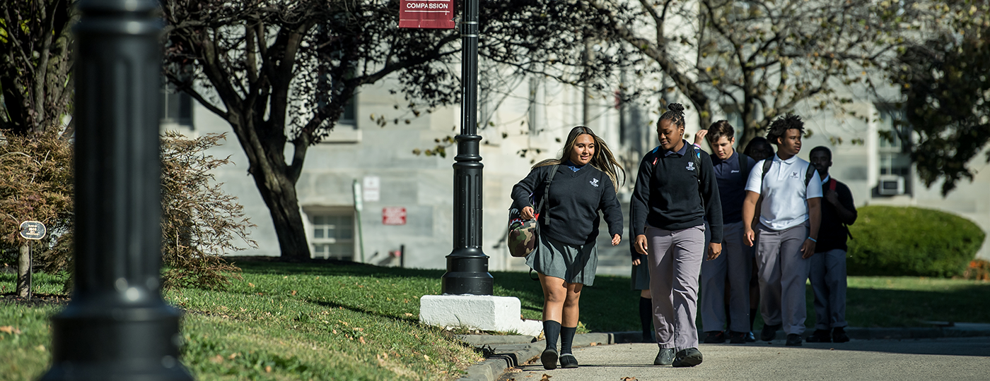 students walking outside on campus