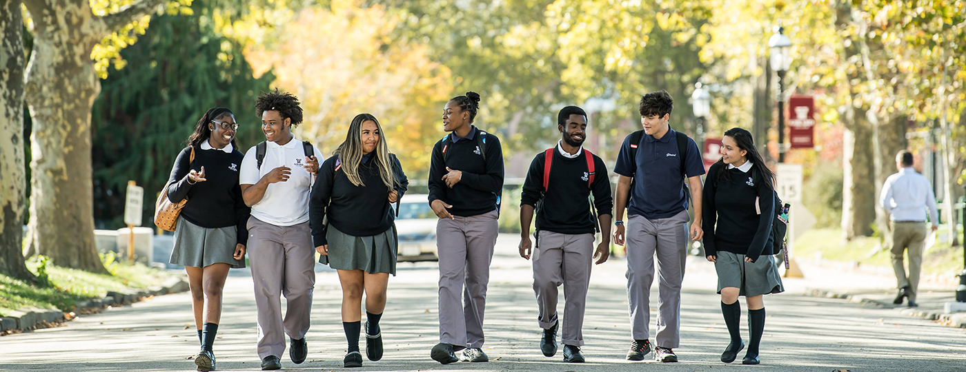 students walking outside on campus