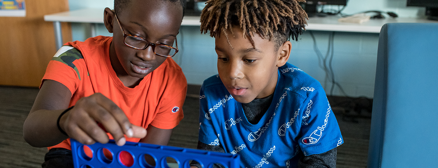 two young boys playing a game