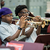 students playing trumpets in a music class