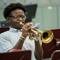 student playing a trumpet