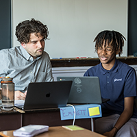 student and a teacher in a classroom