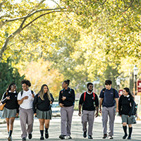 students walking outside on campus